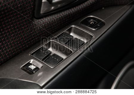 Novosibirsk, Russia - March 10, 2019:  Mazda 3,close-up Of The Side Door Buttons: Window Adjustment 