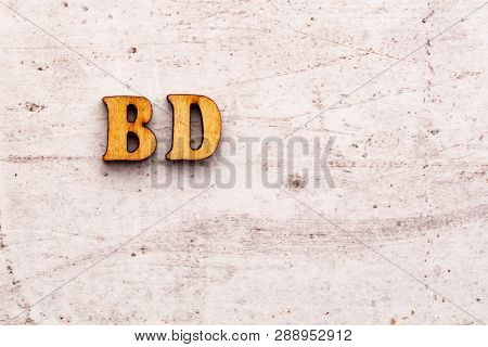 Inscription Bd Bday Birthday Abbreviation In Wooden Letters On A Light Background.