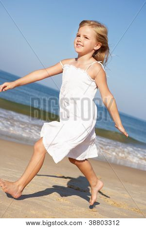 Little Girl Running Along Beach