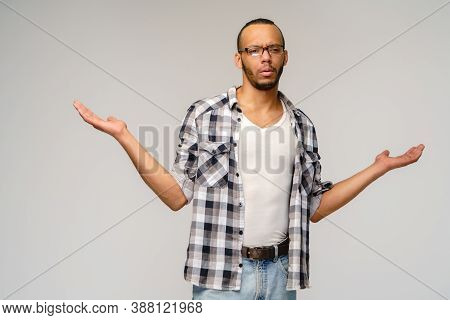 I Dont Know Gesture - Young Afrcian American Man Over Grey Background Being At A Loss, Showing Helpl
