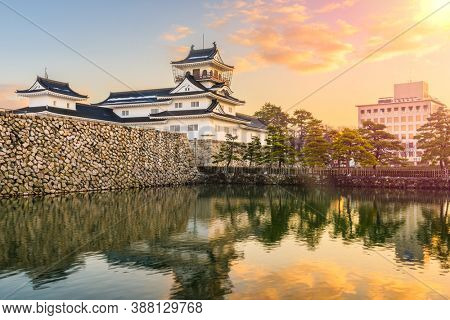 Toyama, Japan at Toyama Castle from the moat at twilight.