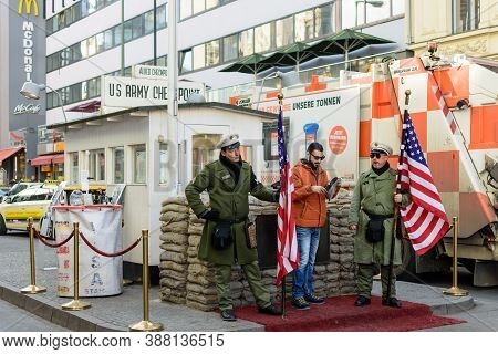 Berlin / Germany - February 15, 2017: Tourist Taking Photos At Checkpoint Charlie, The Best-known Be