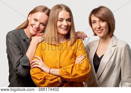 Female Friendship. Trust Support. Positive Attitude. Three Confident Cheerful Mature Women Standing 