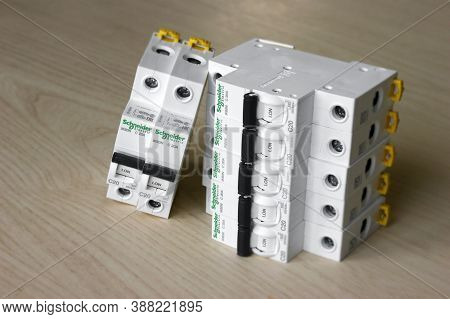 Kharkov, Ukraine - September 22, 2020 : Schneider Electric Circuit Breakers On Light Wood Background