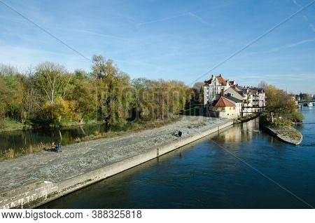 Regensburg, Bavaria, Germany - 11/11/2014: Danube River. Houses On Naberzhnaya. The Stone Bridge Is