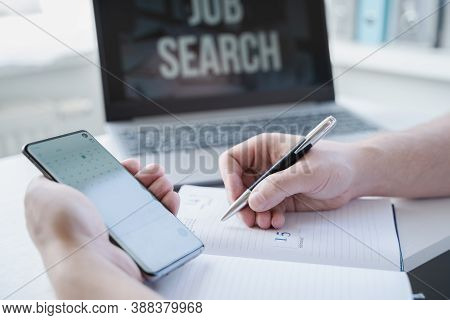 Remote Job Search At Home. Man Appoints Interview For Vacancy In Mobile Phone, Types Meeting Date In