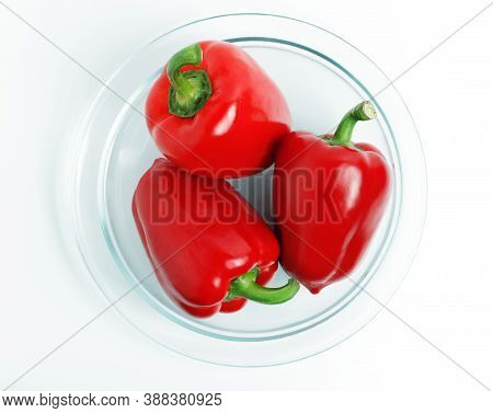 Red Pepper On The Plate. Paprika. Isolated On White Background. Top View