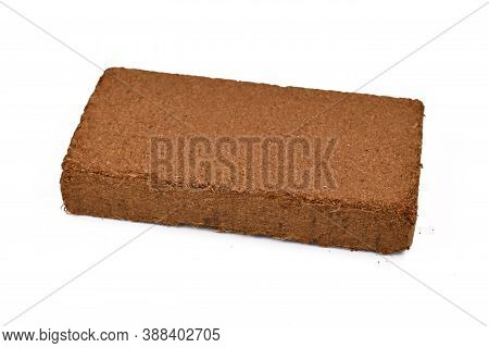 Natural Coconut Fibre Soil Pressed Into Brick Shape Isolated On White Background