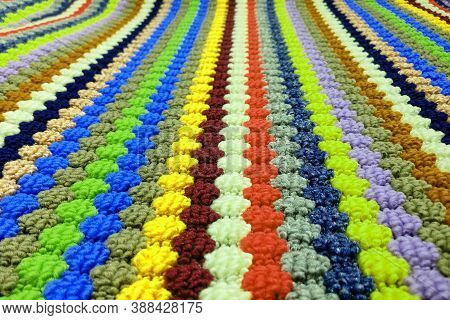 Rug Background Of Knitted Strips Of Different Colors