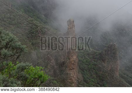 Cliffs Under The Fog On A Hillside.