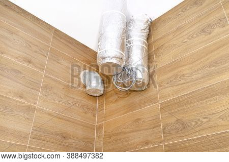 Modern Gas Boiler Room With Brown Ceramic Tiles Imitating Wood, Visible Air Inlet And Outlet, Prepar