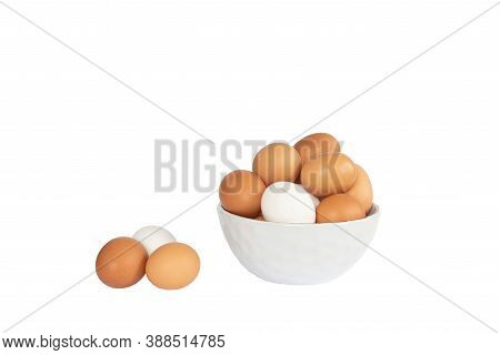 Eggs Lay On White Background. Food Ingredient. Close-up View Of Raw Chicken Eggs In Bowl On Isolated