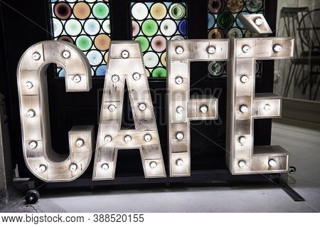 Cafe Vintage Sign Made With Wooden Letters With Lamps Texture. Bar Cafe Caffe Restaurant Office Shop