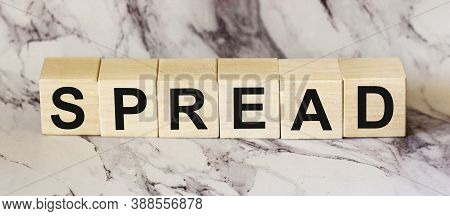 Spread, A Word Written On A Wooden Block. Spread The Word Text On The Table, Concept.