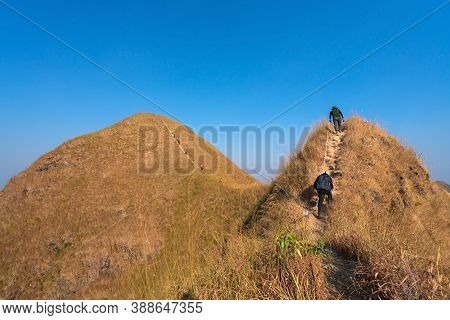 Traveler Man Hiking Enjoying In The Mountains With Backpack At Khao Chang Puak Mountain Thailand