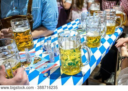 Koblenz Germany 27.09.2019 Close-up Of Bavarian Beer Glasses 1 Liter Bitburger Beer On Table Decoati