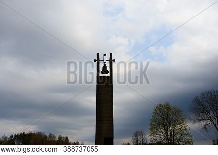 Khatyn, Belarus - 05.02.2020: The Bells In Khatyn With Sky Background. Cemetery Of Burned Vilages.