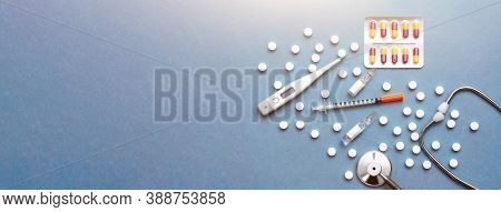 Pills, Ampoule, Syringes, Capsules, Stethoscope On The Blue Doctor S Table. Copy Space. Place For Te