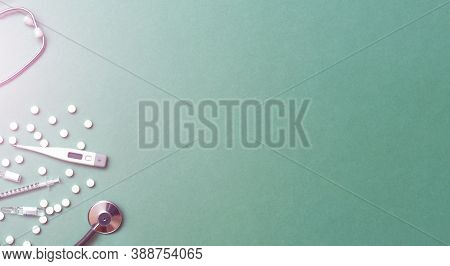 Pills, Ampoule, Syringes, Capsules, Stethoscope On The Green Doctor S Table. Copy Space. Place For T