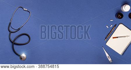 Medical Equipment Stethoscope, Syringe, Thermometer And Notebook On Pastel Blue Color, Healthcare An