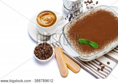 Traditional Italian Tiramisu Dessert In Glass Baking Dish, Savoiardi Cookies, Coffee Maker And Cup O