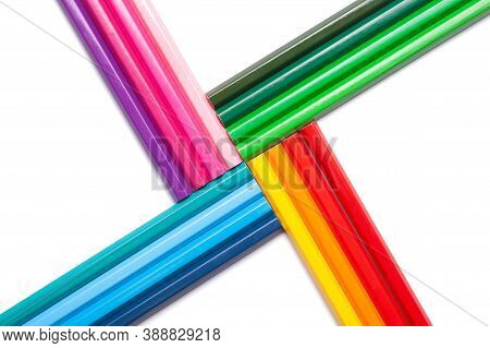 Rainbow Colored Unshaded Pencils In The Shape Of A Greek Cross, Isolated On A White Background