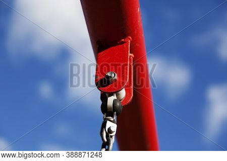 Screw That Holds Swings In Play Position Against Blue Sky
