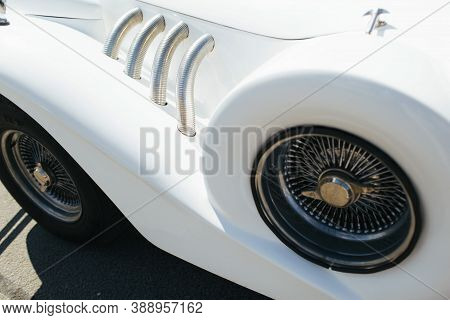 This Wedding Retro Car Is Decorated With Exclusive Flowers And A Yellow Ribbon.