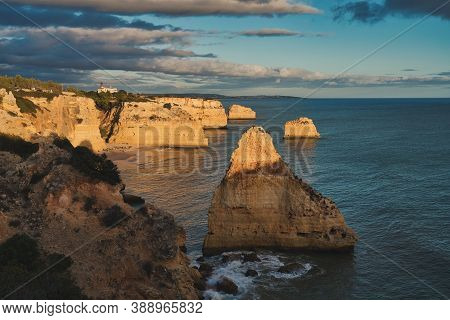 Photo Of Praia Da Marinha In Fato Portugal, At The Sunset Time.