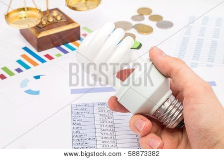 Light Bulb Whit Graph And Euro Coins