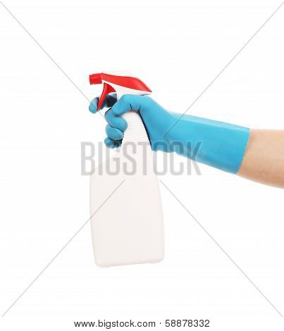 Hand in gloves holds spray bottle.