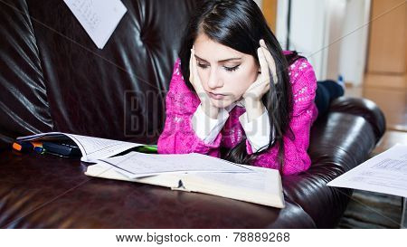 Save Download Preview Tired student having a lot to read. Student girl with lot of paper around