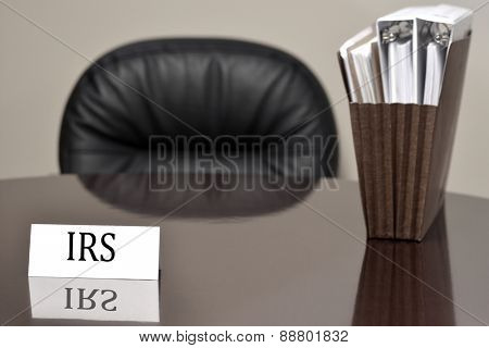 IRS Card on desck with tax files