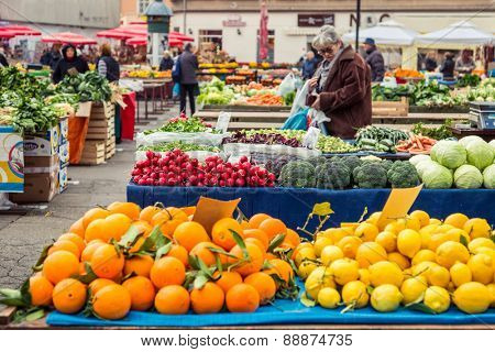 ZAGREB, CROATIA - 12 MARCH 2015: Dolac market full of fruits and vegetables with a view of Zagreb Cathedral.