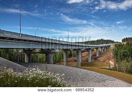 Uncompleted Steel Highway Bridge On Concrete Supports, Crosses Forest Stream