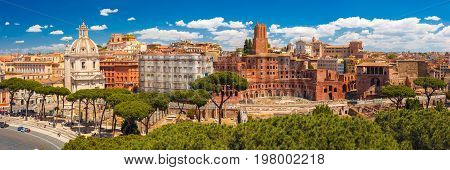 Panoramic view with ancient ruins of Trajan Forum, Market, Trajan Column and church Most Holy Name of Mary in sunny day, Rome, Italy