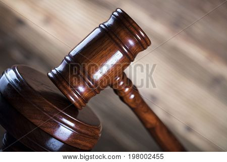 Auction and business concept.  Gavel on the wooden background.