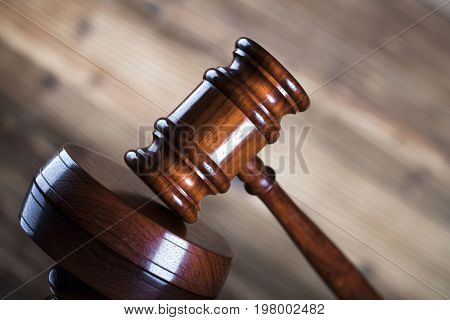 Auction and business concept.  Gavel on the wooden background.