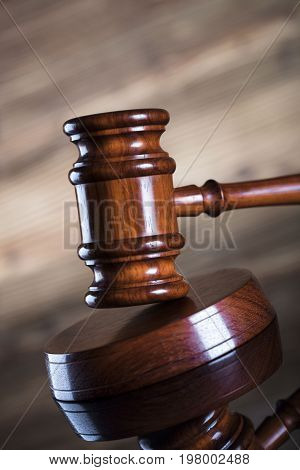 Auction and business concept.  Gavel on the wooden background.
