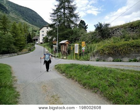 Woman walking in the Lower Engadine near Scuol, Switzerland