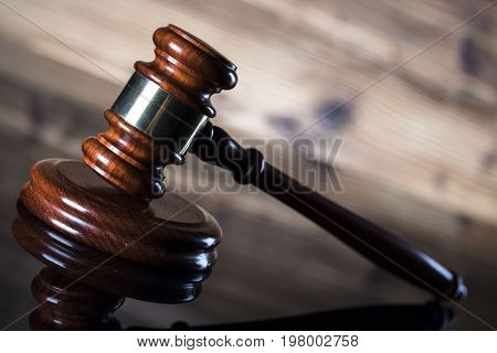 Gavel. Auction and business concept. Wooden background.