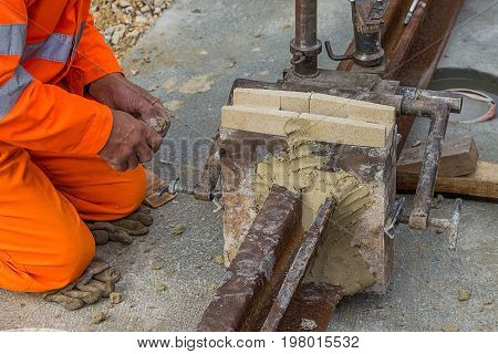 mould and mould material on tram rail before thermit welding process