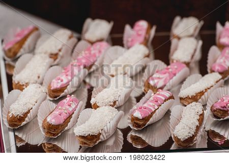 Eclairs, Traditional French Dessert On A Glass