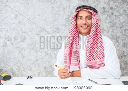 Arab business man sitting at a desk in the office
