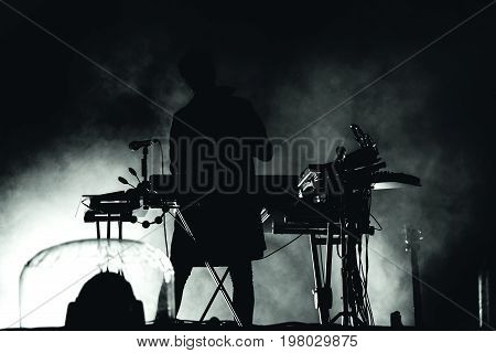 Silhouette Of A Keyboardist In Stage Lights