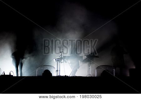 Live Concert. Silhouette Of Artists On The Stage