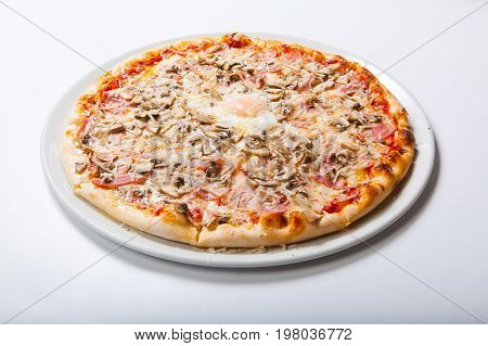 Italy Pizza With Egg Yolk Ham Mushrooms On A White Background