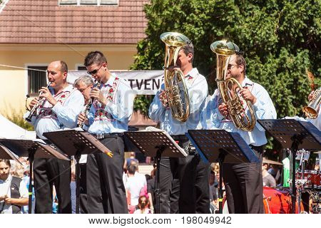 Buchlovice Czech Republic July 29 2017: Traditional brass band at folk festivals. Traditional farmers harvest celebrations of garlic