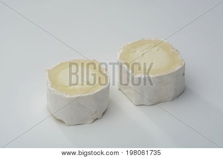 Goat Cheese  on white background, two slices