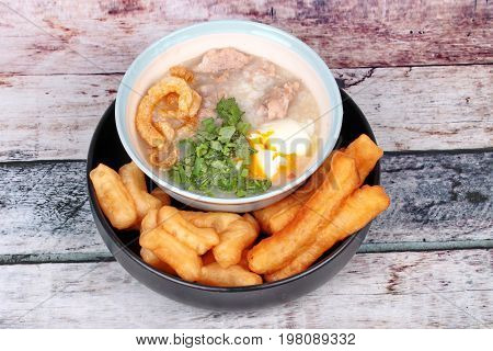Pork's Rice Porridge Served With Deep-fried Dough Stick.
